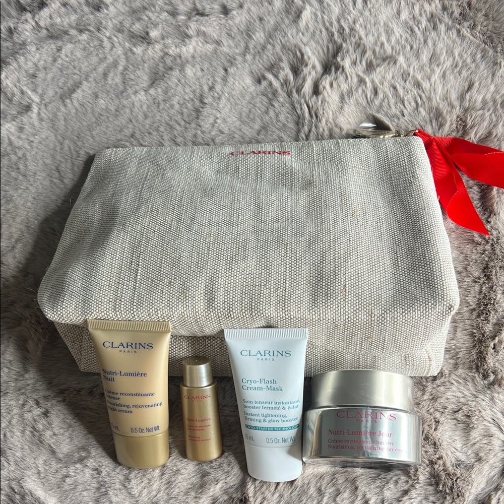 Clarins Skincare Collection with Cream Pouch and Red Ribbon